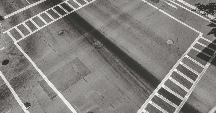 Empty four-way city intersection with crosswalks