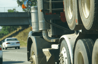 Semi truck on highway with passenger cars